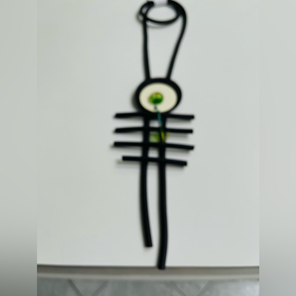 Black rubber tubing necklace with white wooden center